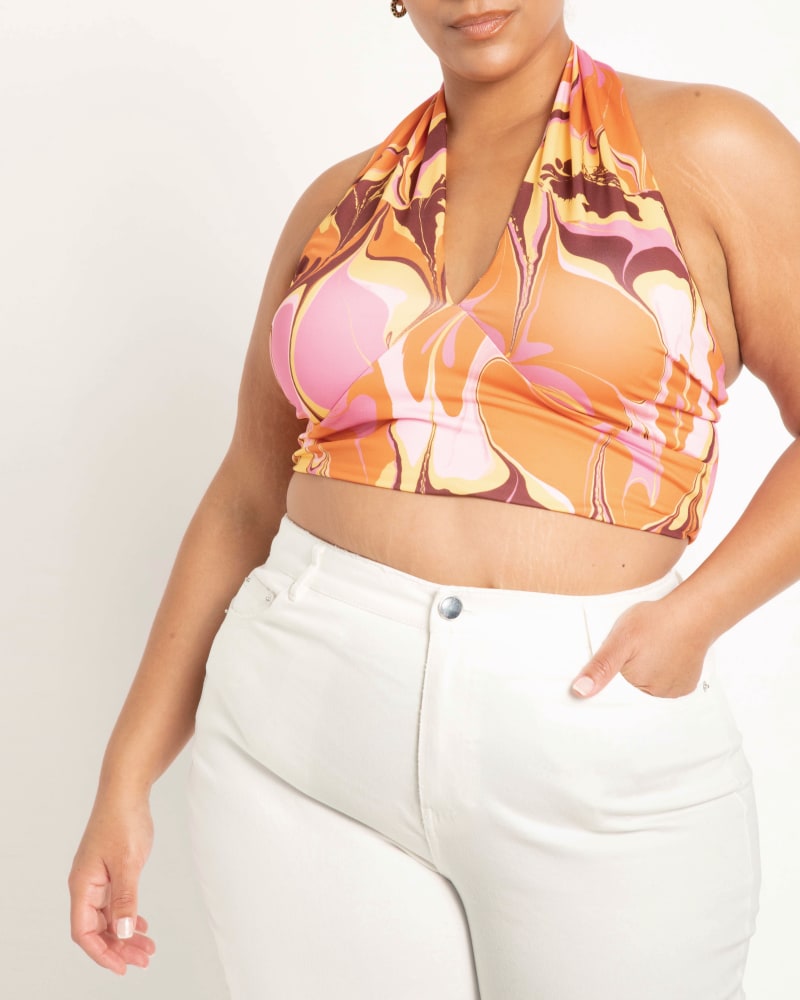 Front of a model wearing a size 14|16 April Crossover Halter Crop Top in Good Vibes Only by ELOQUII. | dia_product_style_image_id:196100